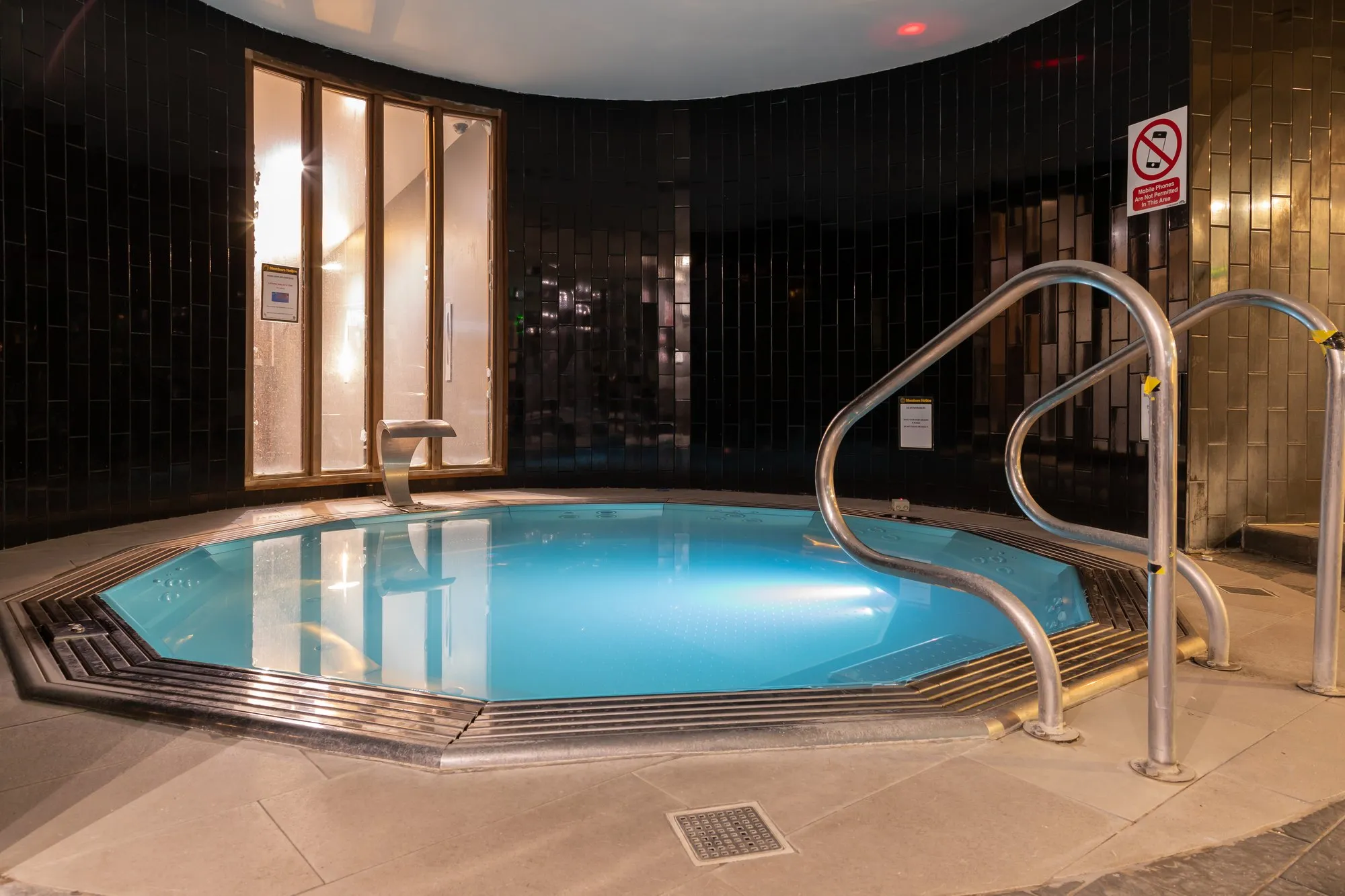 The hot tub, with handrails